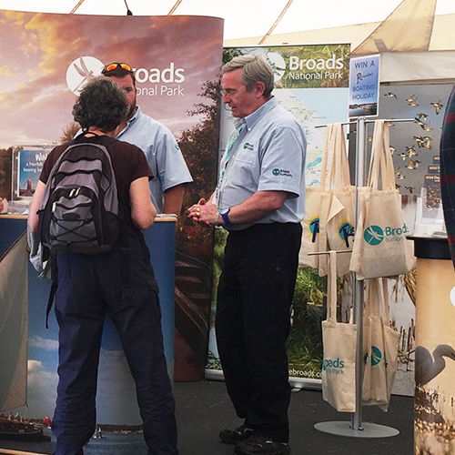 Carrier bag stand in use at an exhibition
